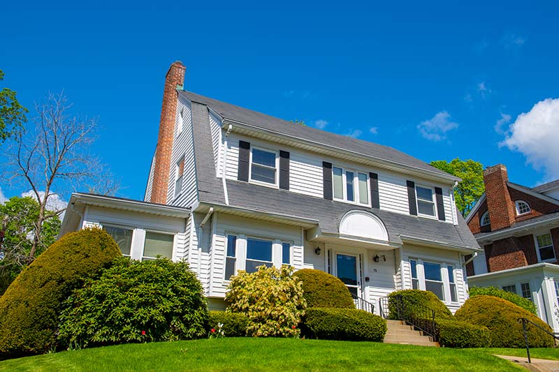 White House with a red brick chimney 